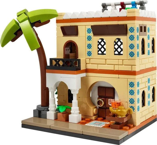 Colorful LEGO houses set featuring a detailed structure with a palm tree and decorative elements