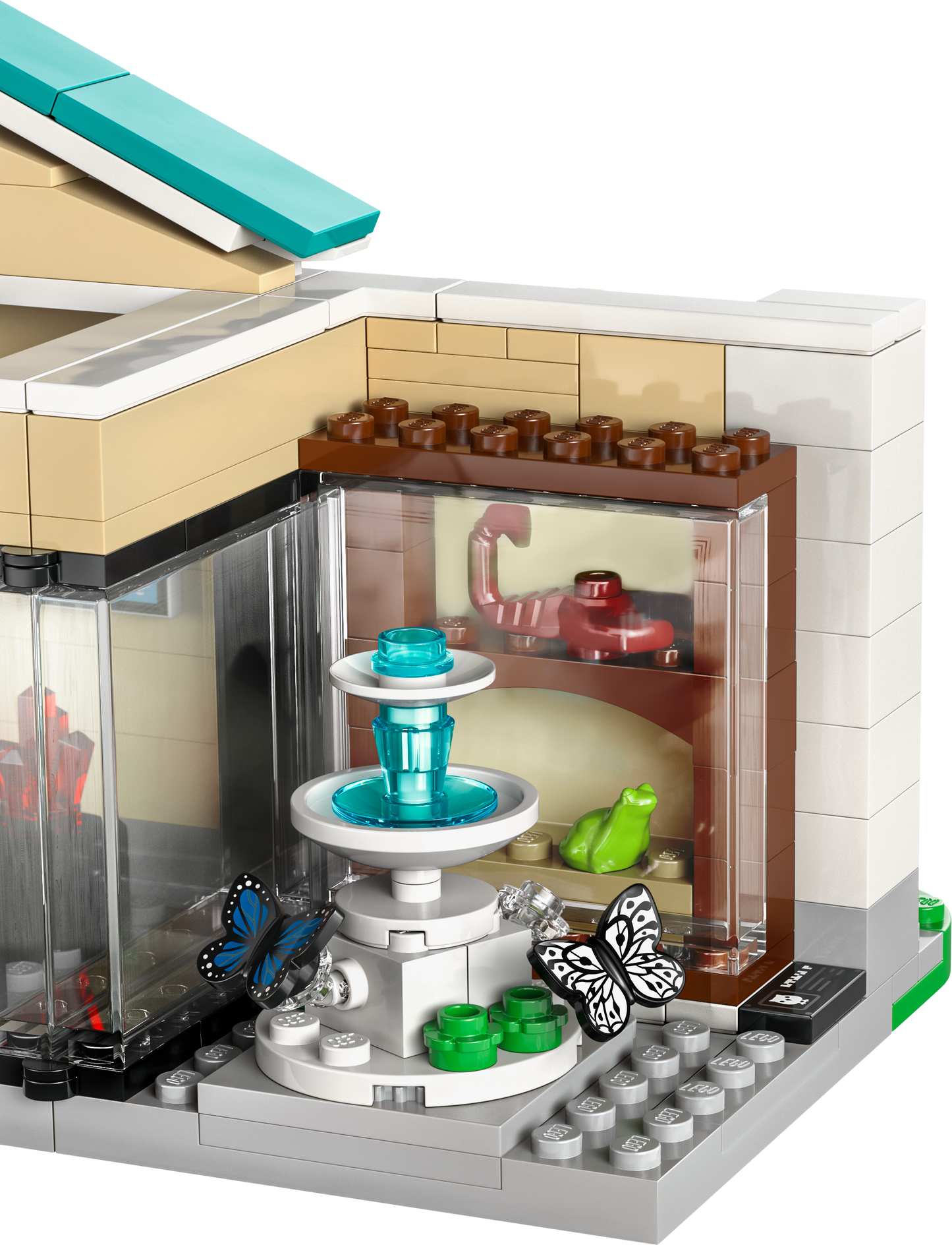 Lego building set with a detailed fountain, butterflies, and display shelves for creative play