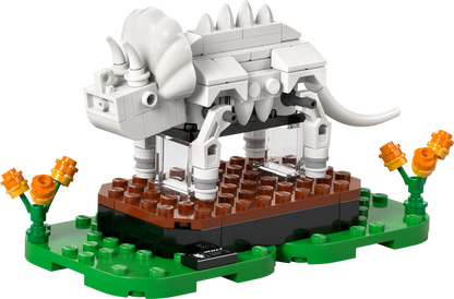 LEGO Triceratops Model on a Display Base with Colorful Flowers and Grass Elements