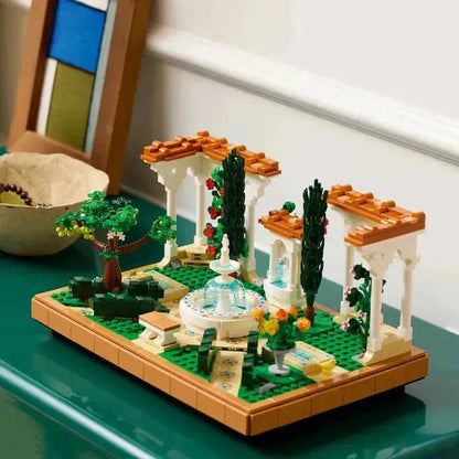 2TTOYS Lego Botanical Garden with floral details and a decorative fountain in a vibrant setting