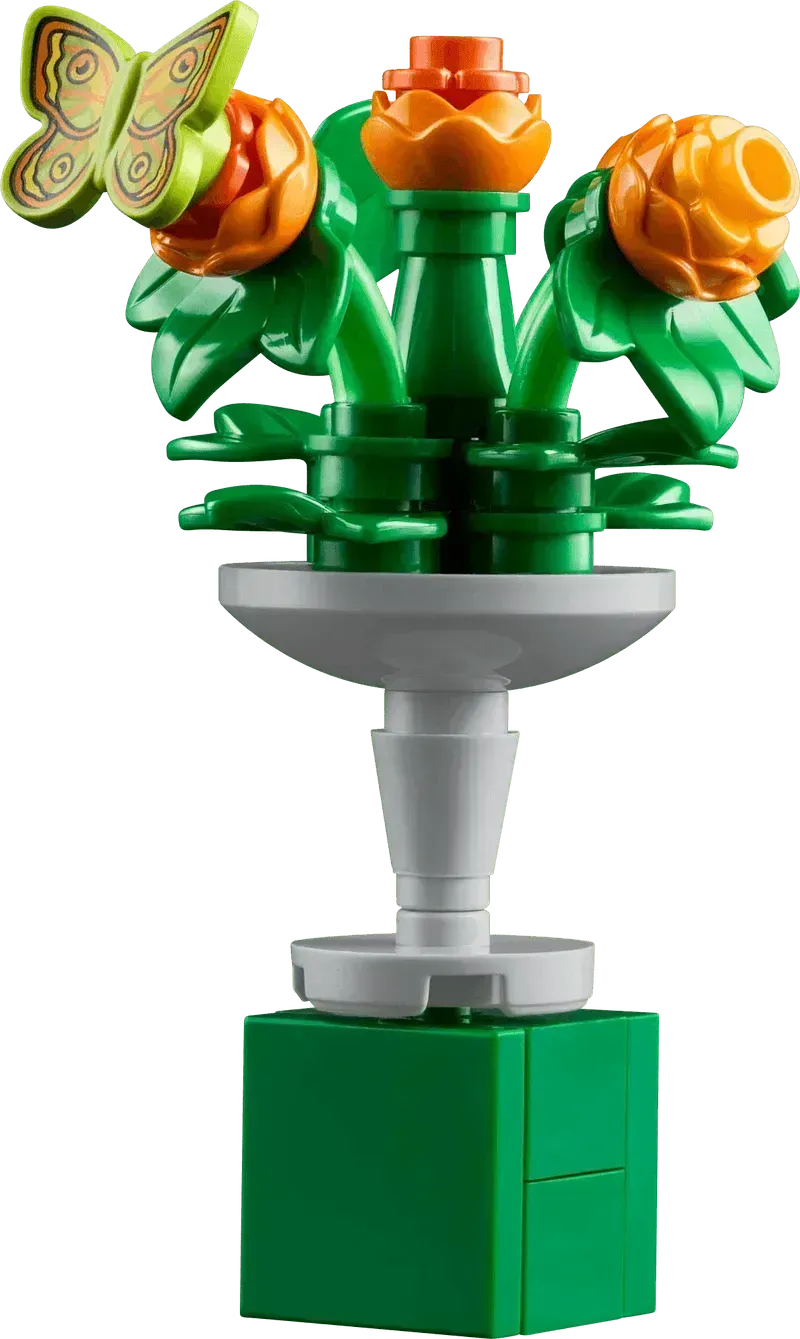Colorful Lego botanical garden flower arrangement with green leaves and a butterfly decoration