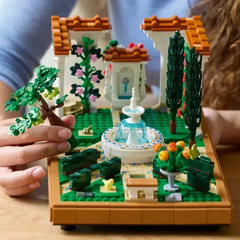 Lego Botanical Garden set featuring a beautiful fountain, trees, and vibrant flowers for creative building