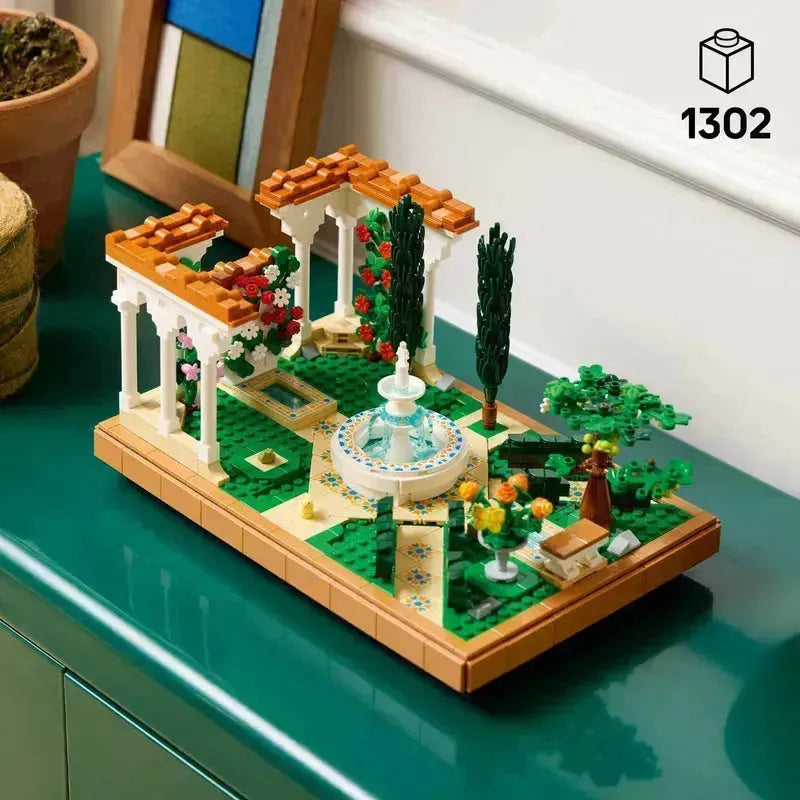 2TTOYS LEGO botanical garden with a fountain, trees, and colorful flowers in a detailed landscape setting