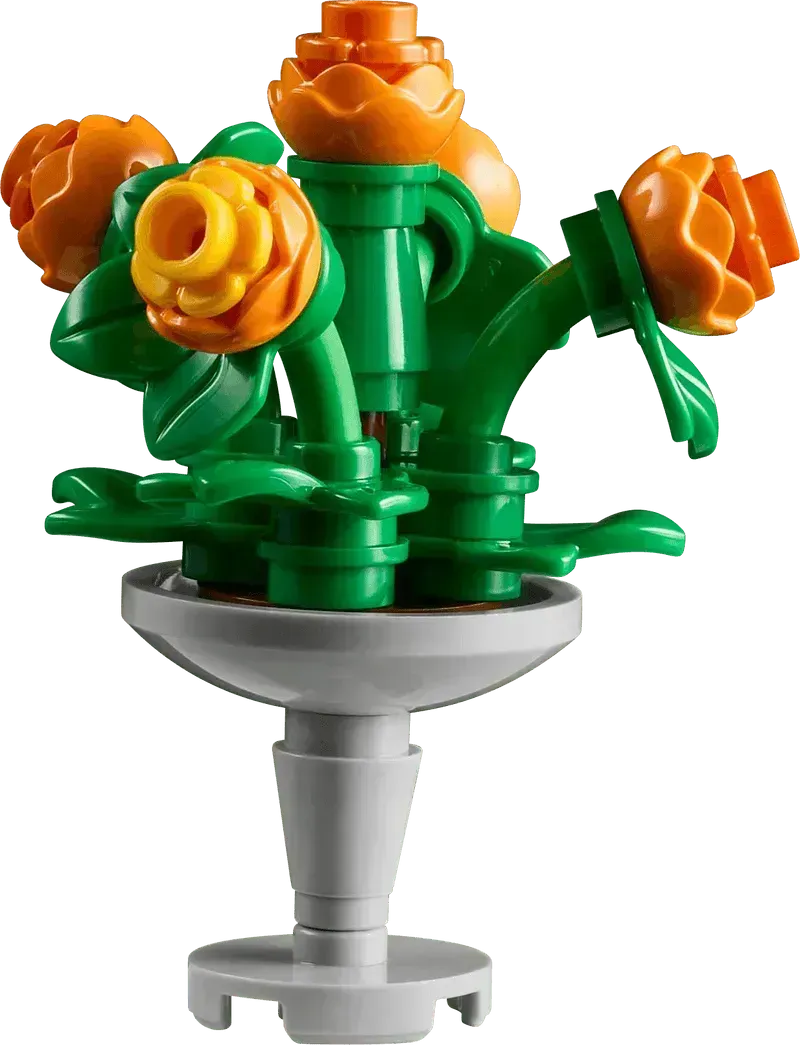 Colorful Lego Botanical Garden flower bouquet with orange roses in a gray vase