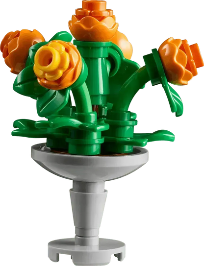 Colorful Lego Botanical Garden flower bouquet with orange roses in a gray vase