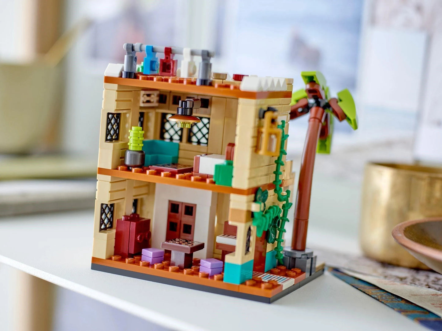 Colorful LEGO house model featuring detailed interior and exterior design of a cozy home