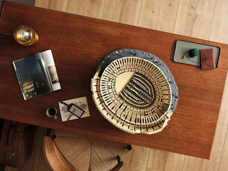 LEGO Creator Expert 10276 Roman Colosseum LEGO model showcasing intricate architectural details on a wooden table