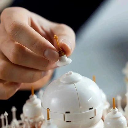 Building a LEGO Architecture model of the Taj Mahal with detailed white domes and gold accents