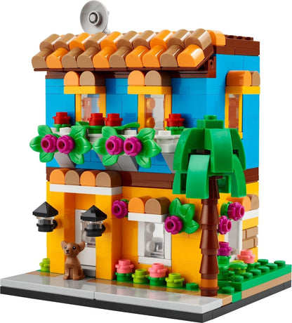 Colorful LEGO building set featuring a two-story house with floral details, resembling waffle houses close to me